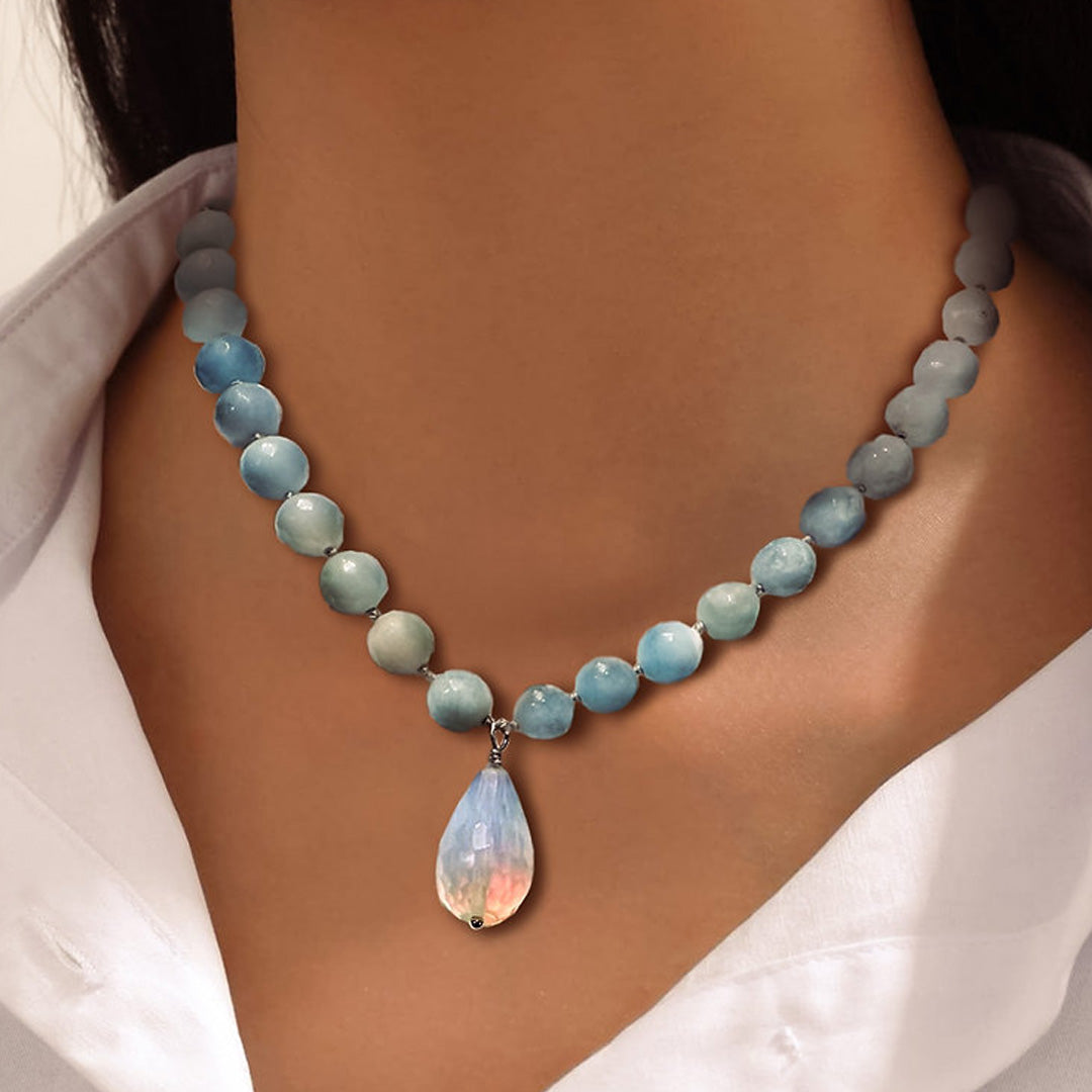 Hand knotted amazonite faceted beads with an iridescent glass pendant