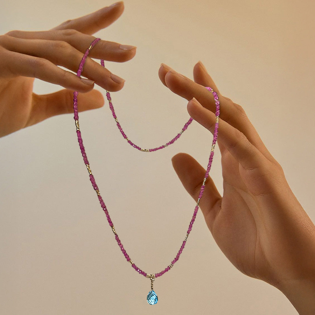 Pink sapphire and topaz necklace