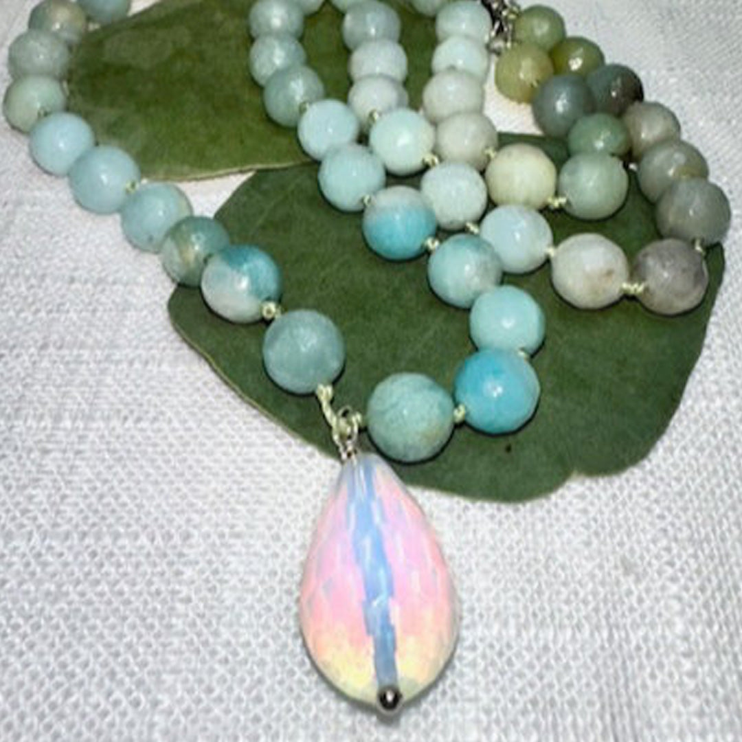 Hand knotted amazonite faceted beads with an iridescent glass pendant